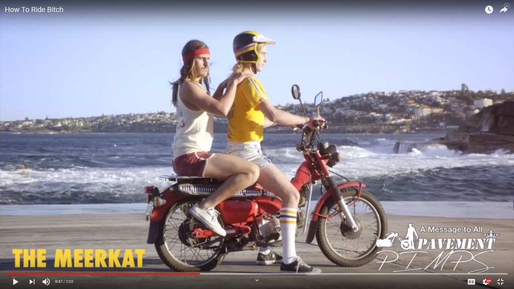 Two men riding the same motorcycle is uncool.