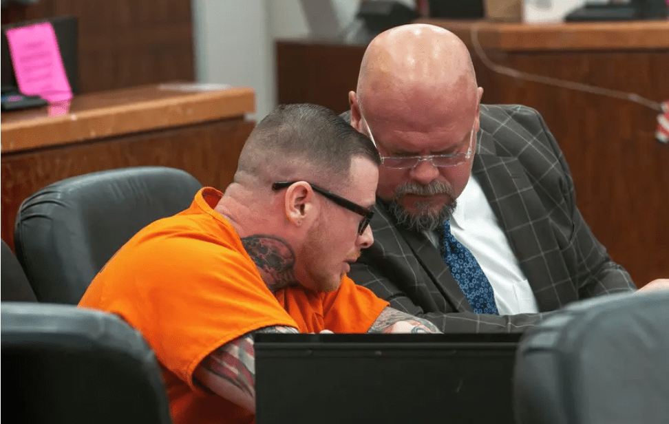 Aaron Grant who plead guilty of killing Jesse Metzger in 2023, speaks to his attorney Joe Wells in 183rd Harris County Criminal District Court, in Houston, Wednesday, Dec 3, 2025.